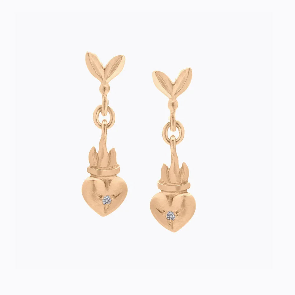 Pair of handcrafted gold earrings with leaf studs and heart-shaped pendants featuring small diamonds