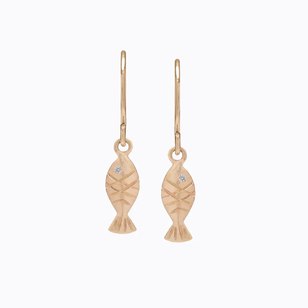 Elegant handcrafted gold fish-shaped earrings with diamond eyes on clean white background