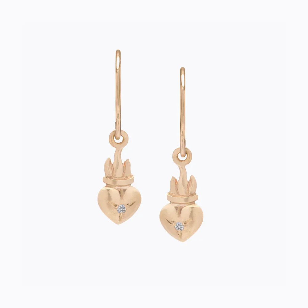 Elegant handcrafted gold flame heart drop earrings with central gemstone, on plain white background