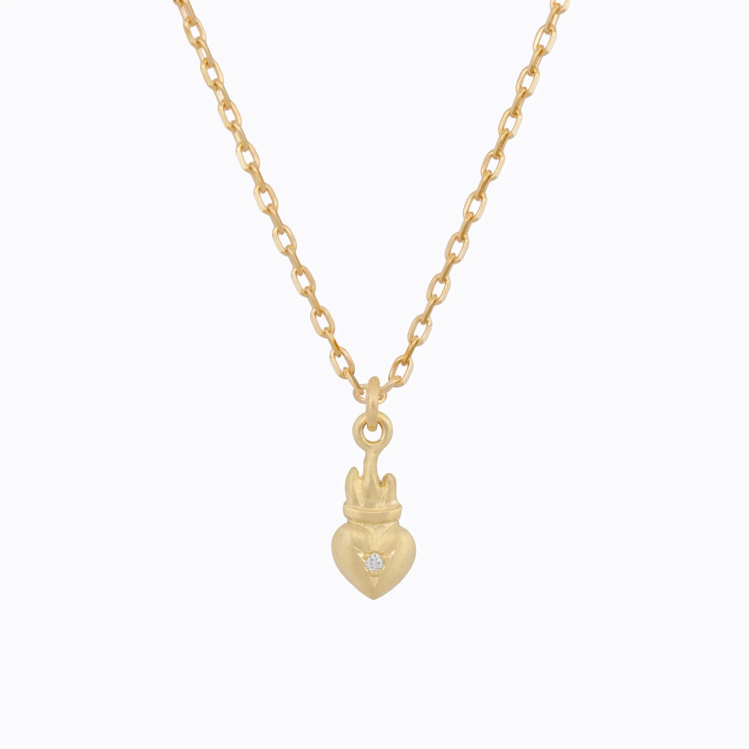 Hand-fabricated 18k yellow gold sacred heart pendant necklace with diamond accent, clean white background