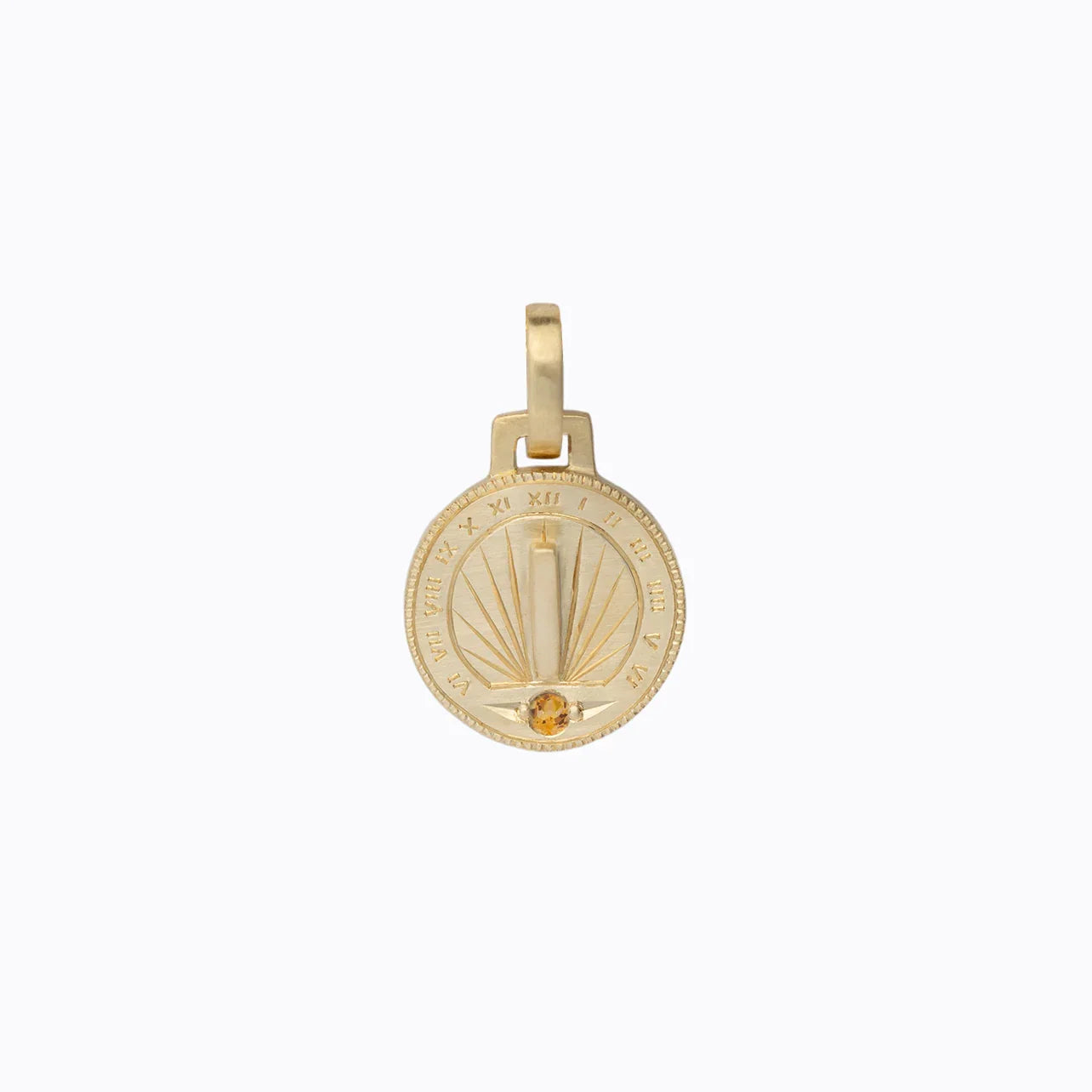 Handcrafted gold sundial pendant with Roman numerals and citrine gem, on soft neutral background