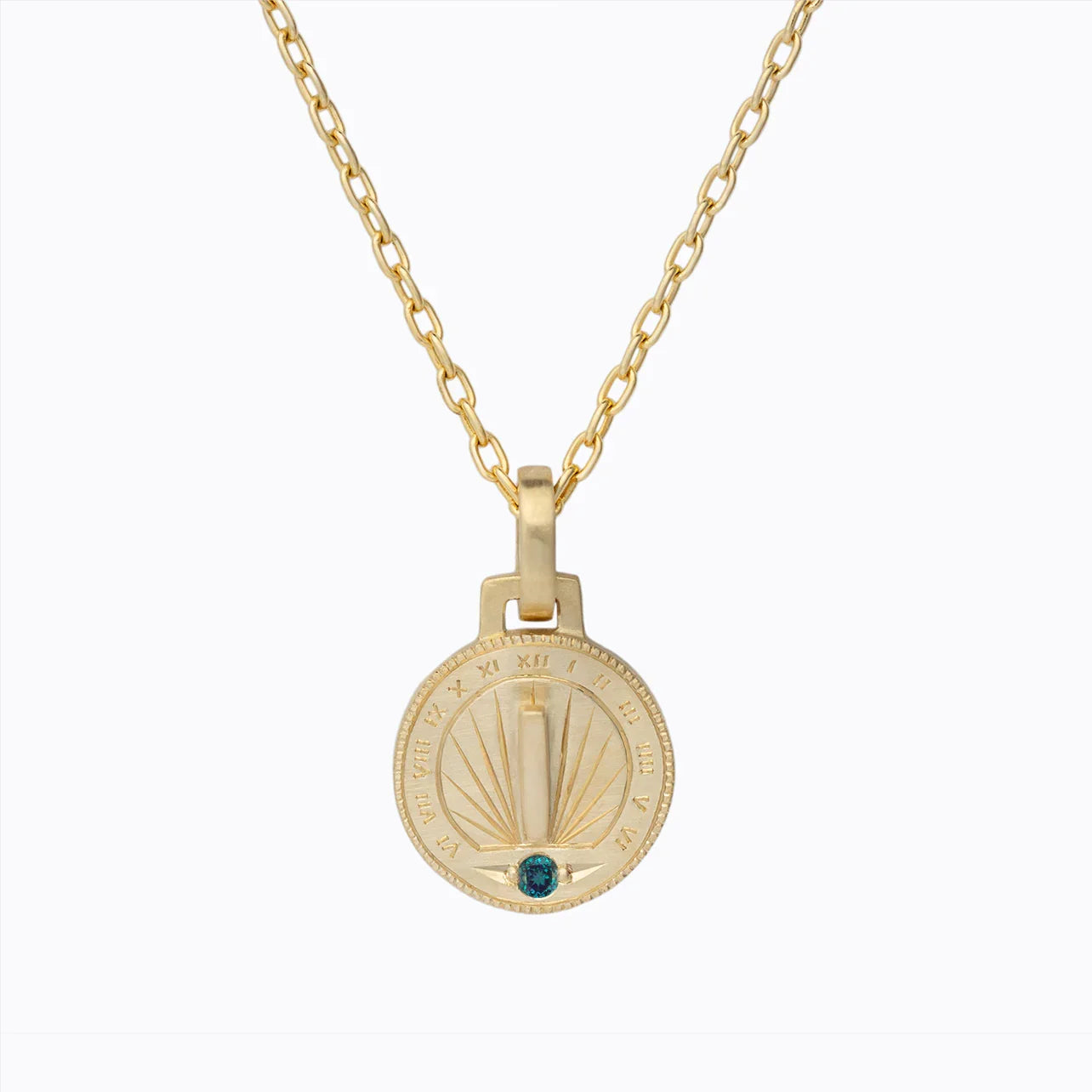 Handcrafted gold sundial pendant with Roman numerals and blue gemstone on gold chain