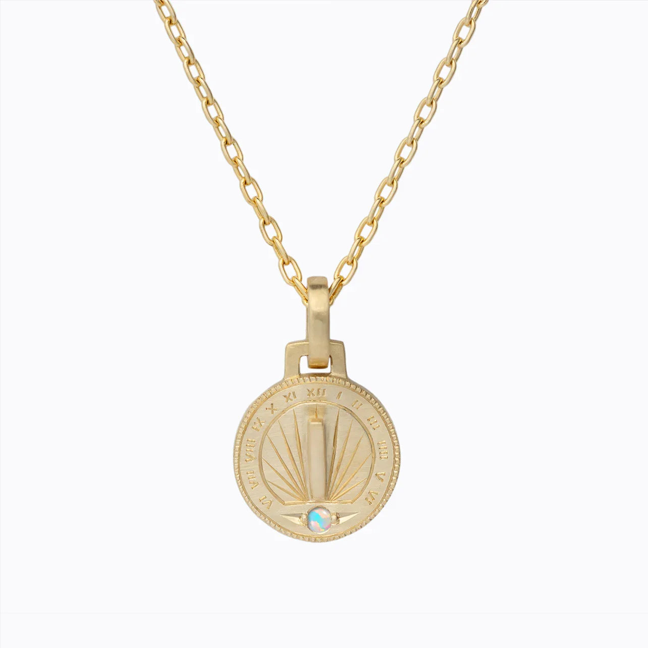 Hand-fabricated gold sundial pendant necklace with Roman numerals and opal gem on white background