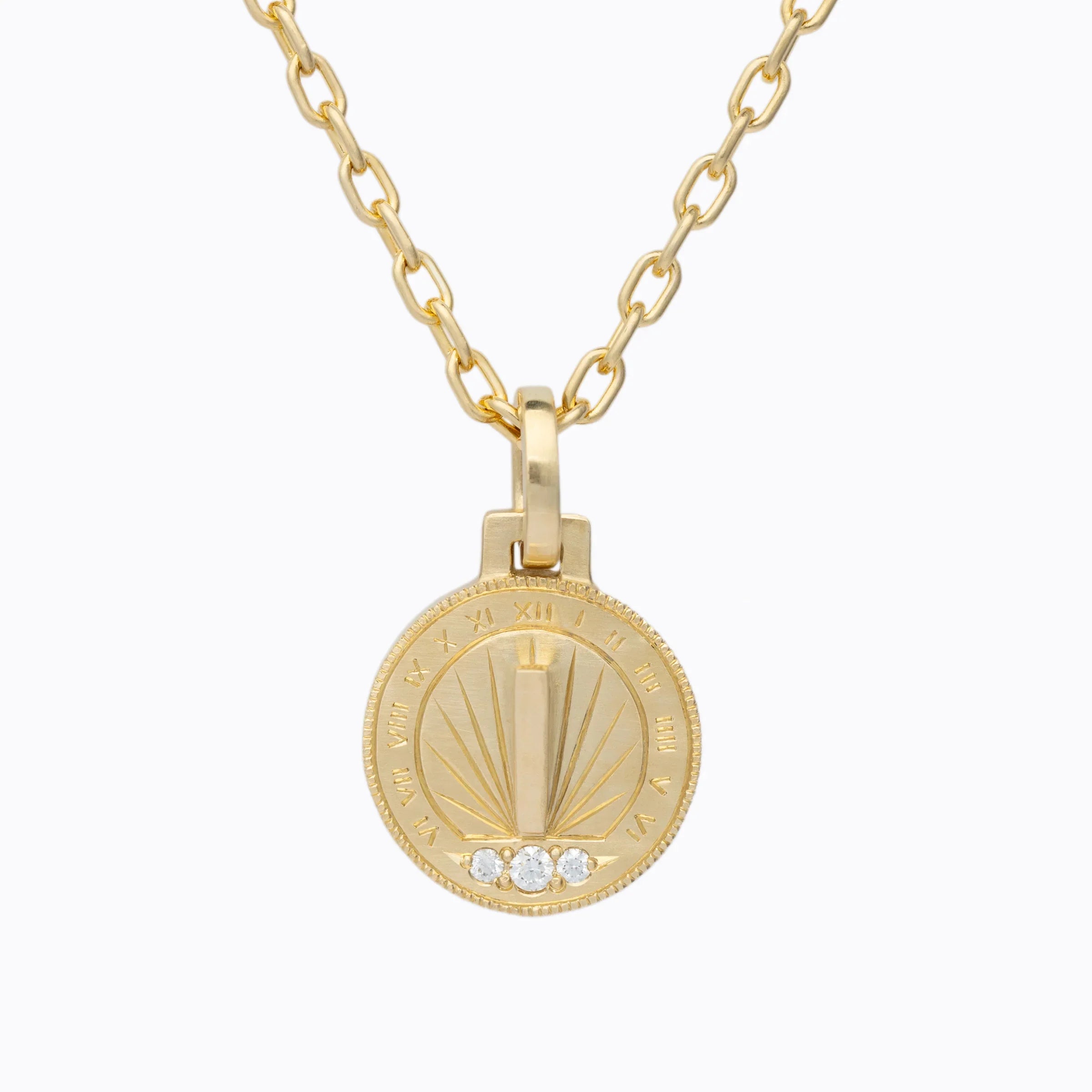 Elegant handcrafted gold sundial pendant with Roman numerals and three small diamonds on gold chain