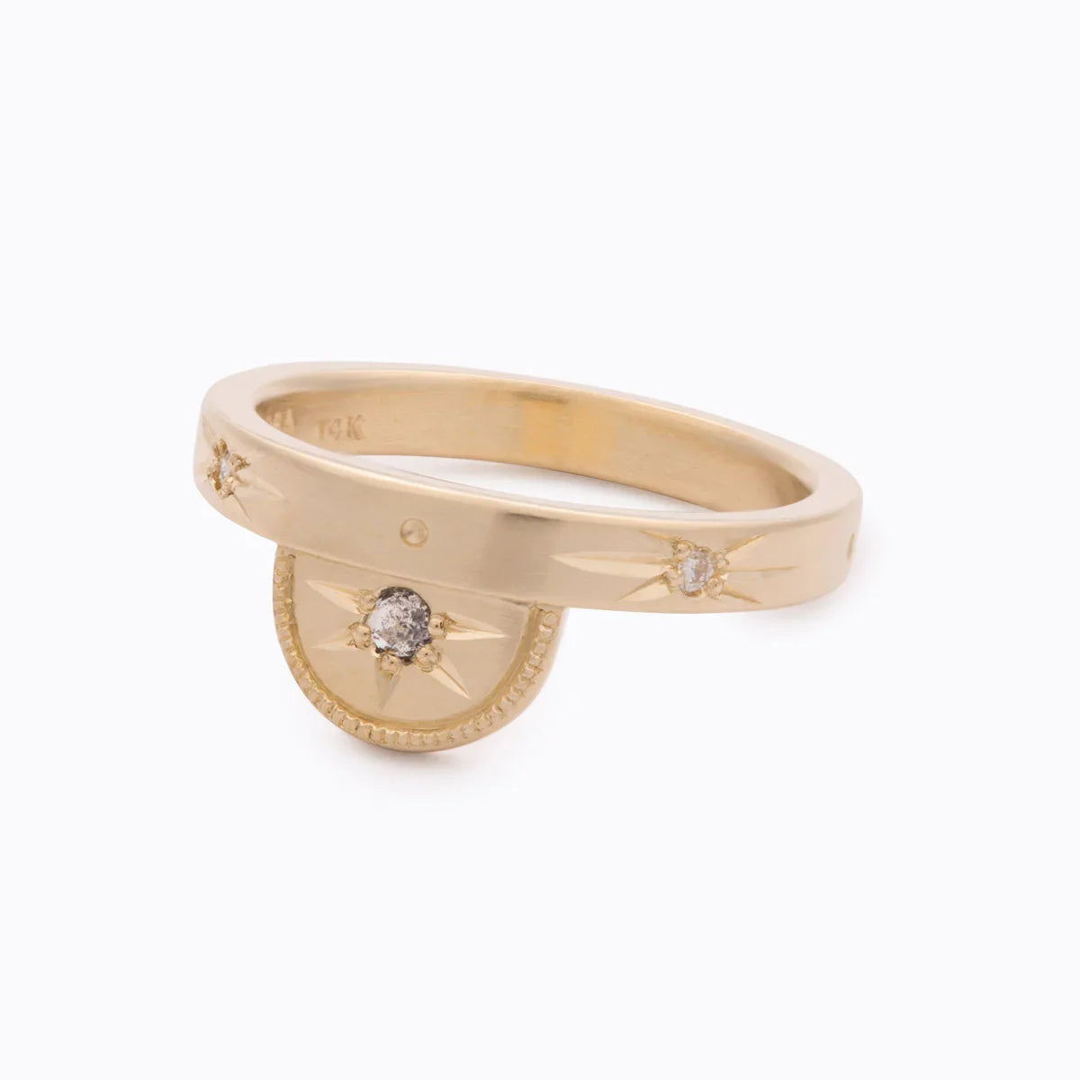 Elegant 14k gold ring with hand-engraved star motifs and rustic diamonds, minimalist white background