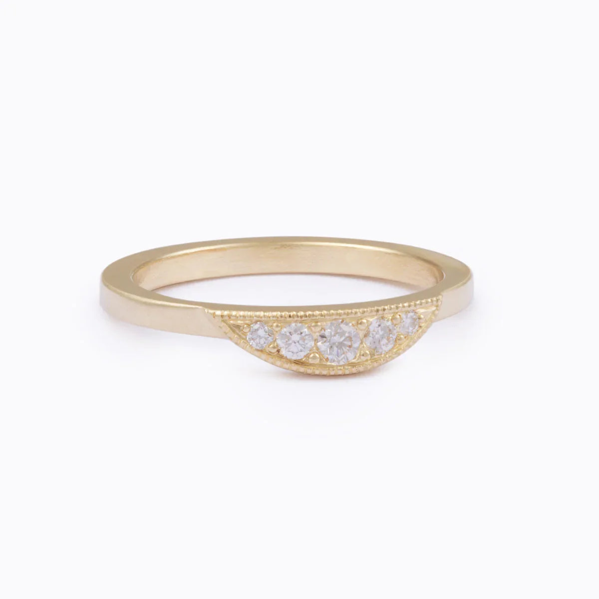 Elegant Fairmined gold half-moon ring with five sparkling diamonds on soft white background