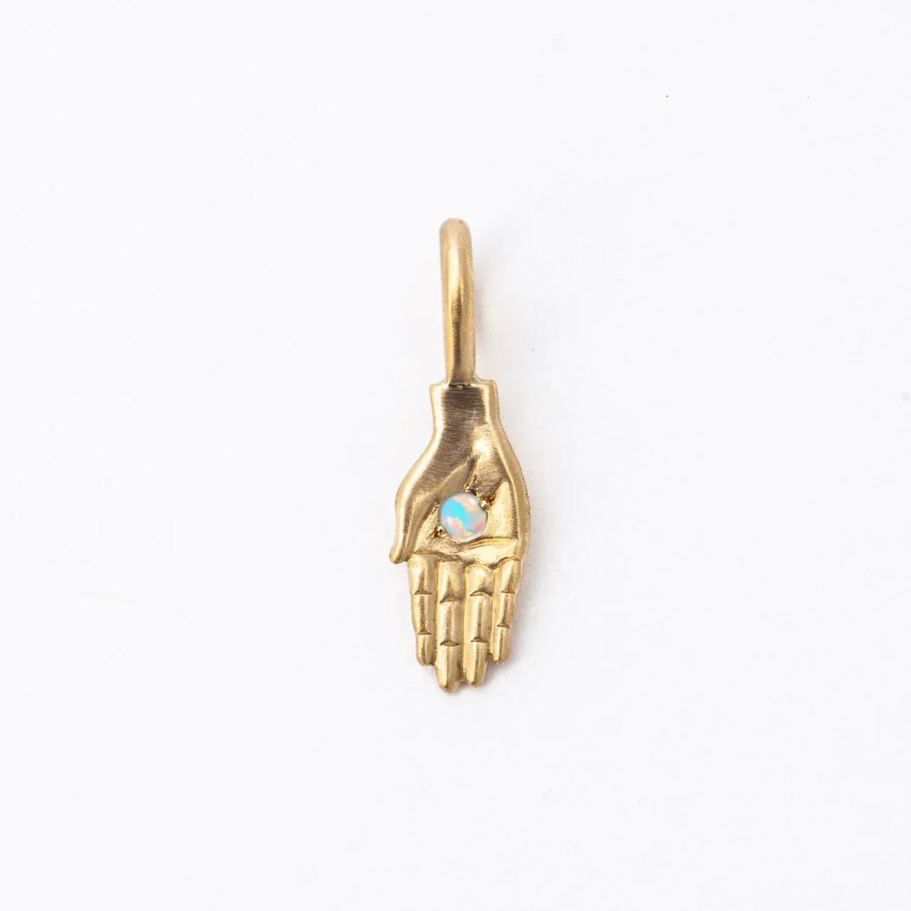 Handcrafted gold hand pendant with iridescent opal set in palm, minimalist white background