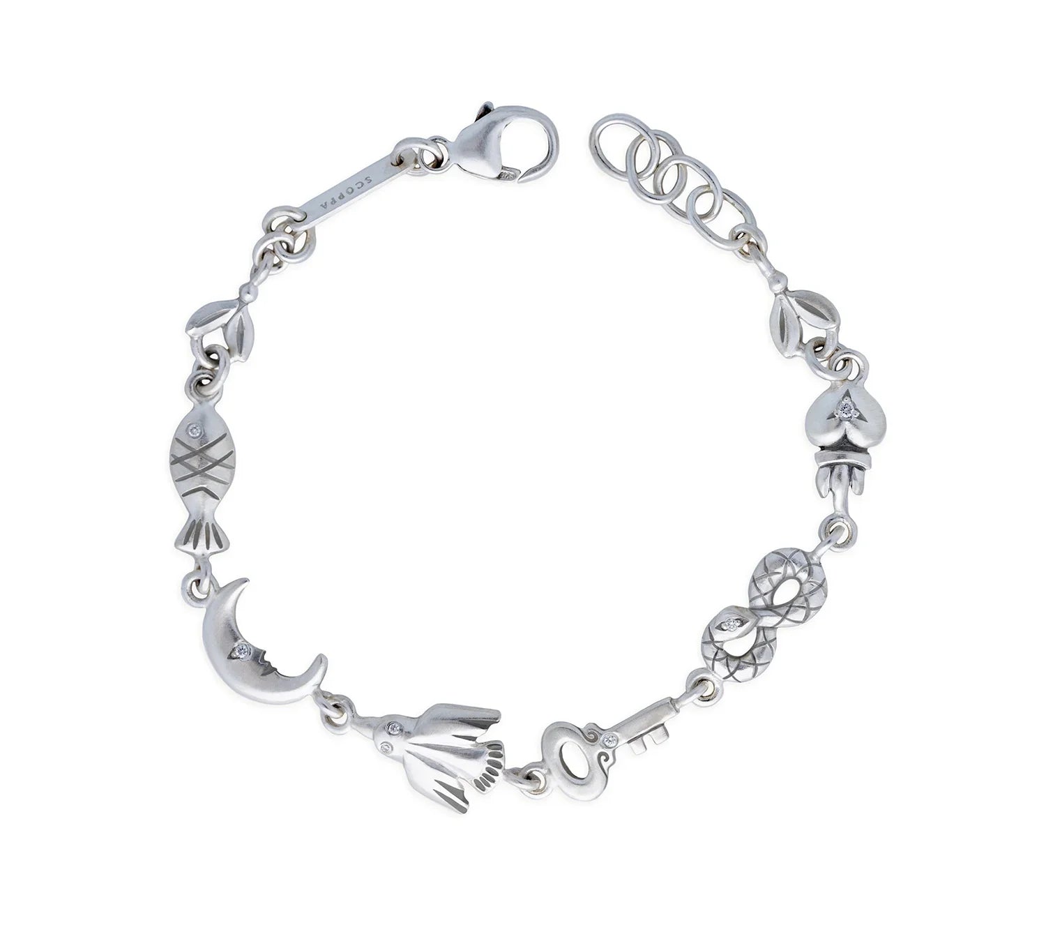 Hand-fabricated silver charm bracelet with moon, key, fish, and flower motifs on white background